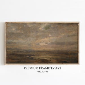 Könnte beinhalten: Gerahmtes Landschaftsgemälde mit einer gedämpften Farbpalette aus Braun-, Grau- und Grüntönen. Das Kunstwerk zeigt einen bewölkten Himmel über einem dunklen, undeutlichen Horizont. Der Rahmen ist aus hellem, natürlichem Holz. Der Text unten lautet "PREMIUM FRAME TV ART" und "3840 x 2160".
