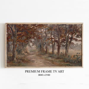 Könnte beinhalten: Gerahmtes Landschaftsgemälde, das einen Weg durch einen Wald mit herbstlichen Bäumen zeigt. Das Kunstwerk verwendet eine gedämpfte Farbpalette aus Braun-, Grün- und Orangetönen. Der Text "PREMIUM FRAME TV ART" und die Abmessungen 3840 x 2160 sind sichtbar.