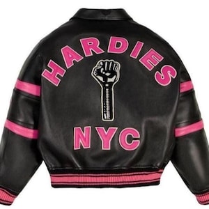 May include: Black leather jacket with pink accents and the text "HARDIES NYC" in pink. The jacket features a graphic of a raised fist. The cuffs and waist have pink and black striped ribbing.