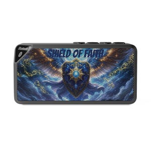 May include: Black rectangular Bluetooth speaker with a graphic design. The design features a shield with a star in the centre, set against a blue and gold celestial background. The text "SHIELD OF FAITH" is displayed across the speaker.