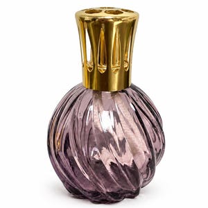May include: A spherical glass fragrance lamp featuring a translucent light purple color with a swirling ribbed texture. The top of the lamp is fitted with a polished gold-toned metal crown cap that has several cut-out openings for ventilation.