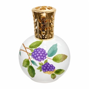 May include: A white spherical fragrance lamp featuring a hand-painted design of purple blackberries and green leaves on a brown branch. The top of the lamp is capped with a shiny gold-toned metal crown featuring heart-shaped cutouts.