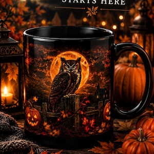 May include: A black ceramic mug featuring a graphic of an owl perched on a fence against a large orange full moon. The text reads Spooky Season STARTS HERE and COFFEE TEA COZY NIGHTS. The design includes autumn leaves, pumpkins, and a lantern.