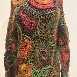 Freeform crochet sweater. Warm fall colors:olive, terracotta, yellow, brown, green. Size Sm- Med.