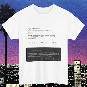 May include: A white ceramic mug with a black handle and the text "But First, Coffee" in a black, bold font. The mug is on a white surface.