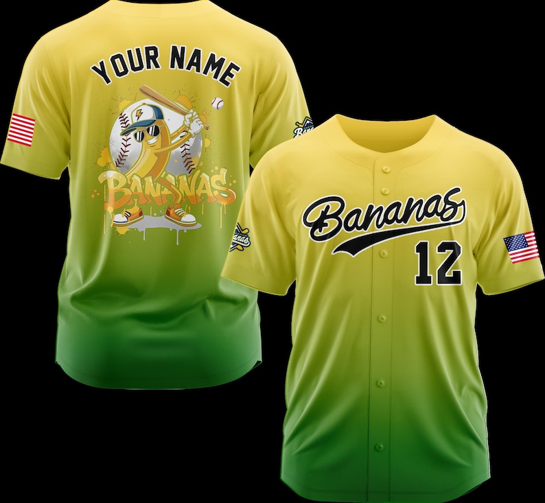 May include: Yellow and green baseball jersey with the word "Bananas" in black script and the number "12". The jersey has an American flag patch on the sleeve. The back of the jersey has a cartoon banana playing baseball with the words "Your Name" above it.