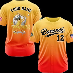 May include: Yellow, orange, and red baseball jersey with the word "Bananas" in black script and the number 12. The back of the jersey features a cartoon banana playing baseball with the words "Your Name" above it.