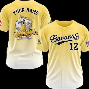 May include: Two yellow baseball jerseys. One features a cartoon banana character with a baseball bat and the text "Bananas". The other jersey has the word "Bananas" and the number "12" in black.
