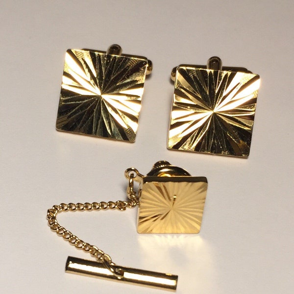 Golden Cuff links with matching tie tac. Star Diamond cut