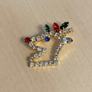 Broche de férias Rudolph, a rena do nariz vermelho