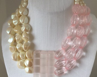 Bib Style Necklace. Lightweight Plastic, Plated chain hook clasp.