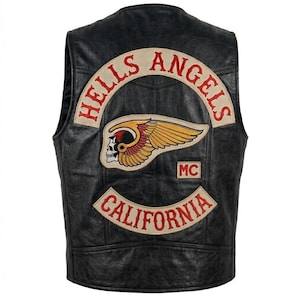 May include: Black leather vest with the "Hells Angels" logo patch on the back. The patch features a winged skull and the word "California". The vest is sleeveless and has a classic biker style.