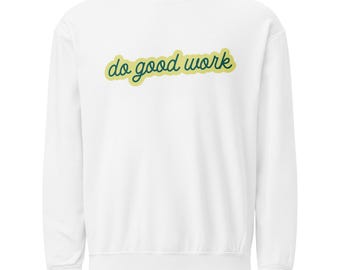 May include: White sweatshirt with the text "do good work" in a green script font with a yellow outline. The long-sleeved crew neck sweatshirt is a casual style.