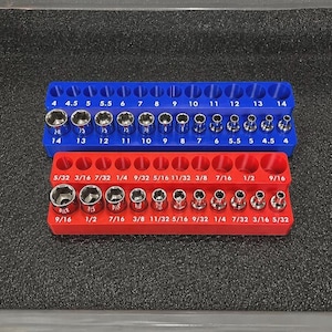 May include: A blue plastic socket organizer tray containing metric steel sockets sized 4 through 14, and a red plastic socket organizer tray containing imperial steel sockets sized 5/32 through 9/16, both featuring clearly printed size labels.