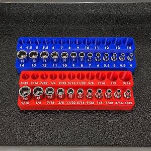 May include: A blue plastic socket organizer tray containing metric steel sockets sized 4 through 14, and a red plastic socket organizer tray containing imperial steel sockets sized 5/32 through 9/16, both featuring clearly printed size labels.