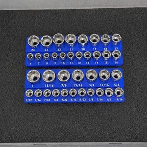 May include: A set of chrome sockets arranged on two blue holders. The sockets are labeled with sizes in inches, ranging from 5/32 to 1 1/2 inches. The set includes both standard and metric sizes for various mechanical tasks.
