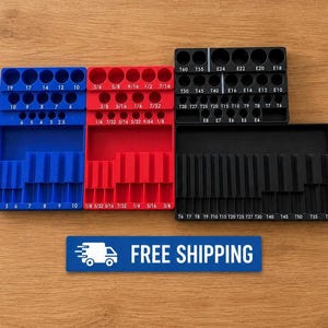 May include: Three rectangular tool organizers in blue, red, and black, featuring labeled circular slots and vertical channels for bits. The blue and red organizers have fractional and metric labels, while the black organizer features T and E labels.