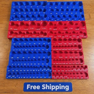 May include: A collection of blue and red plastic socket organiser trays featuring moulded circular slots for various tool sizes. The trays are labelled with numerical markings in inches and millimetres, including fractions like 1/4, 3/8, and 1/2, alongside a blue sign with the text Free Shipping.