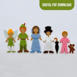 May include: A set of felt cutouts featuring a fairy with light blue wings, a character in a green tunic and hat, a figure in a blue dress, a person in a white outfit with a black top hat, a black umbrella, a pink outfit, and a brown teddy bear.