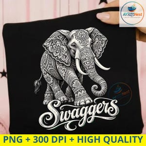 May include: A black t-shirt featuring a white graphic of an elephant decorated with intricate floral and geometric patterns. Below the elephant, the word Swaggers is printed in a stylized white script font. The design is high contrast and detailed.