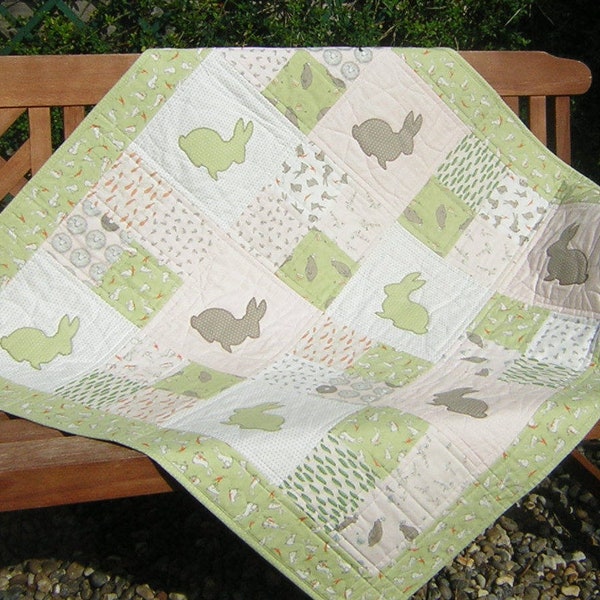 Patchwork cot quilt with applique rabbits. 100% cotton, Moda 'Darling Little Dickens'. Neutral colours light green & grey.  Ready to ship.