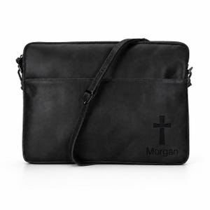 May include: A black rectangular laptop bag with a smooth finish, featuring an adjustable shoulder strap and a top zipper closure. The bottom right corner displays a debossed cross symbol positioned directly above the name Morgan in black text.