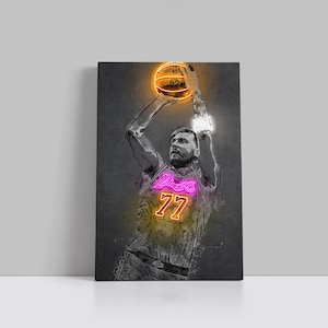 May include: A canvas print of a basketball player in a Lakers jersey, mid-shot. The jersey number 77 and the word "Lakers" are in neon pink. The basketball and the player's arms have neon orange and white highlights against a dark gray background.