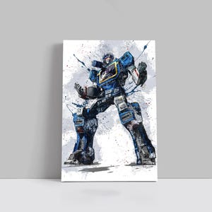 May include: A watercolor-style print of a blue and black robot with a yellow chest. The robot is in a dynamic pose against a white and gray splattered background. The artwork is displayed on a white canvas.
