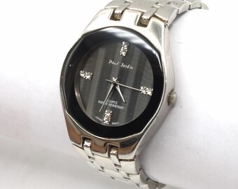 Vintage wristwatch chrome polished silver metal with clear stones analog black dial water resistant Paul Jardin watch Japan