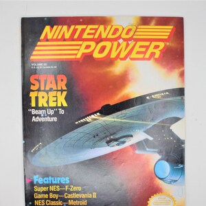 May include: A vintage Nintendo Power magazine cover featuring a Star Trek starship against a red and orange background. The cover text reads "Star Trek" and "Beam Up" To Adventure. The magazine is volume 25 and features a Nintendo seal.