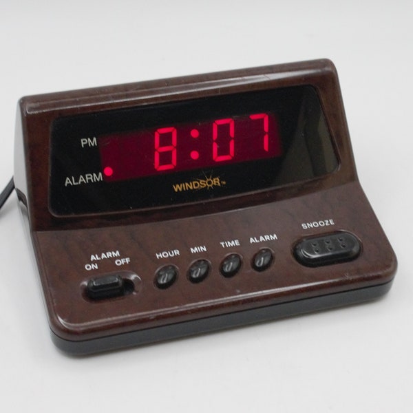 Vintage digital alarm clock simulated burled walnut woodgrain case red lighted LED display buzzer mod hi-tech 1980s design Windsor