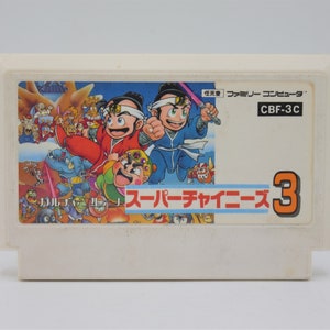 May include: A vintage Nintendo Entertainment System (NES) game cartridge for the game "Super Dodge Ball 3". The cartridge is white with a colorful label featuring the game's title and characters. The label also includes the text "Family Computer" and "CBF-3C".