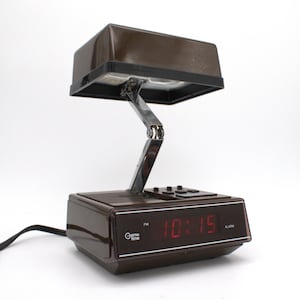 Vintage 1970s digital alarm clock table lamp red LED lighted display folding nightstand desk lamp brown woodgrain mod design Cosmo Time