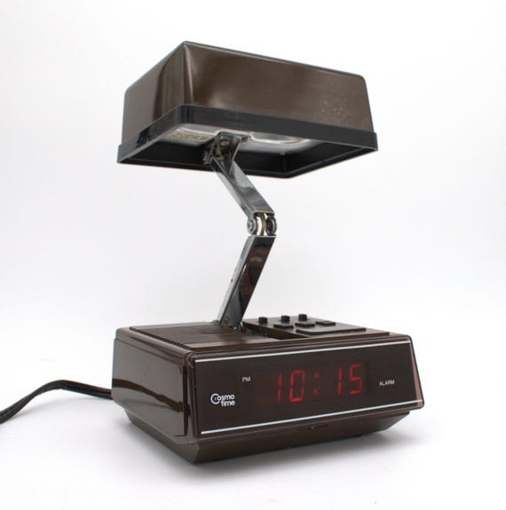 Vintage 1970s digital alarm clock table lamp red LED lighted display folding nightstand desk lamp brown woodgrain mod design Cosmo Time