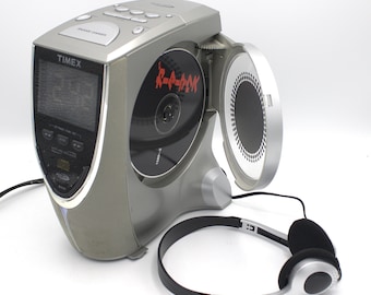 Vintage stereo CD player radio AM/FM auto set digital alarm clock relaxing nature sounds sleep mode futuristic mod design headphones Timex