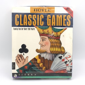 May include: A box for the Hoyle Classic Games computer game. The box features a colorful illustration of a king of hearts playing cards. The text on the box reads "Hoyle Classic Games" and "Family Fun for Over 200 Years".