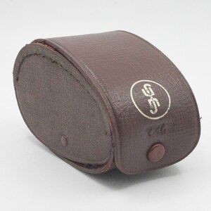 May include: A brown leather case with a white circle containing the letters "GSS" and the word "Prat" printed on it.