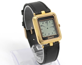 Vintage 1980s analog dial LCD quartz digital watch gold tone case black leather strap band cool 80s fashion wristwatch