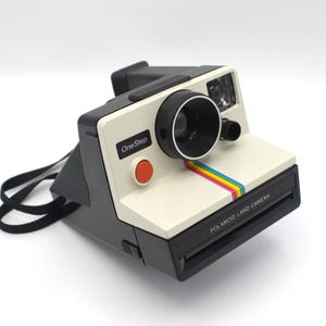 Vintage 1980s Polaroid One Step Land Camera instant photography film white with color rainbow stripe retro 80s tech