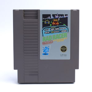 May include: A white ceramic mug with a black handle and the text "But First, Coffee" in a handwritten style. The mug is on a white surface. The mug is 4 inches tall.