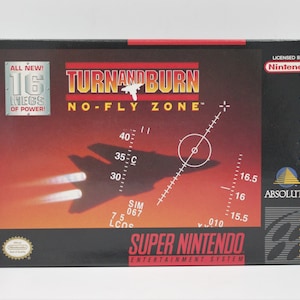 May include: A black Super Nintendo game cartridge box with a red and black design. The box features a fighter jet flying through the air with the words "Turn and Burn: No-Fly Zone" printed on the front. The box also includes the text "All New! 16 Megs of Power!" and "Licensed by Nintendo".
