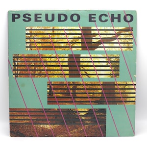 May include: A vintage album cover with the text "PSEUDO ECHO" in black block letters. The cover has a teal background with rectangular cutouts revealing a blurred image of a tree and foliage. Pink diagonal lines intersect the design.