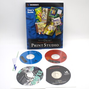 May include: A Micrografx Windows Draw Print Studio Premier Edition software package. The package includes a user's guide, four CDs, and a few inserts. The user's guide is blue with the text "User's Guide" and "Print Studio". The CDs are blue, red, and black.
