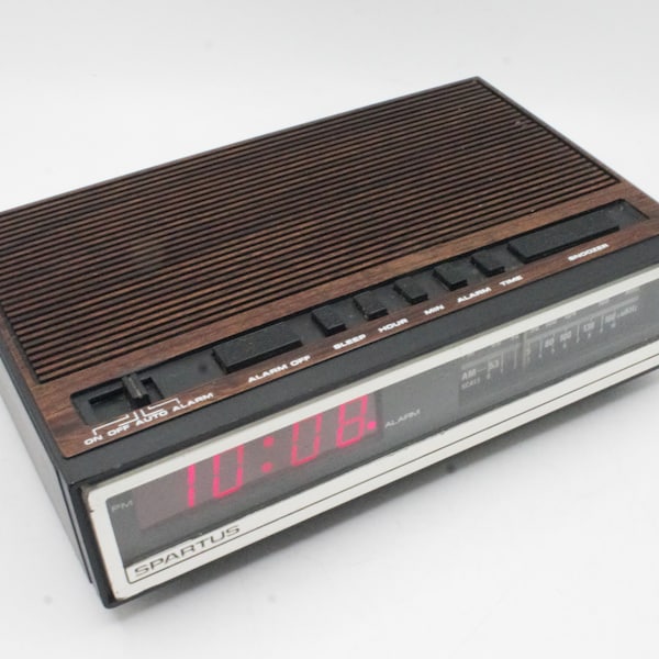 Vintage 1980s digital alarm clock radio AM/FM tuner with analog dial and red LED lighted time display cool mod woodgrain Spartan electronic