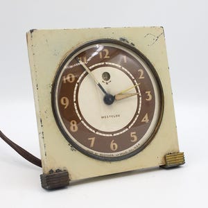 Vintage Westclox alarm clock gear driven electronic movement with bell ringer wake metal and brass with domed glass art deco analog dial USA