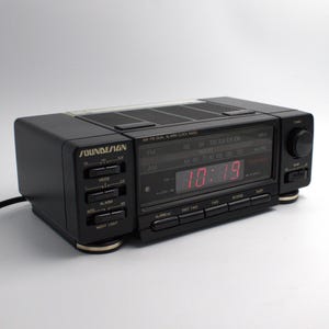 Vintage Soundesign digital dual alarm clock radio AM/FM receiver red LED lighted time display auto nightlight lamp 90s audio
