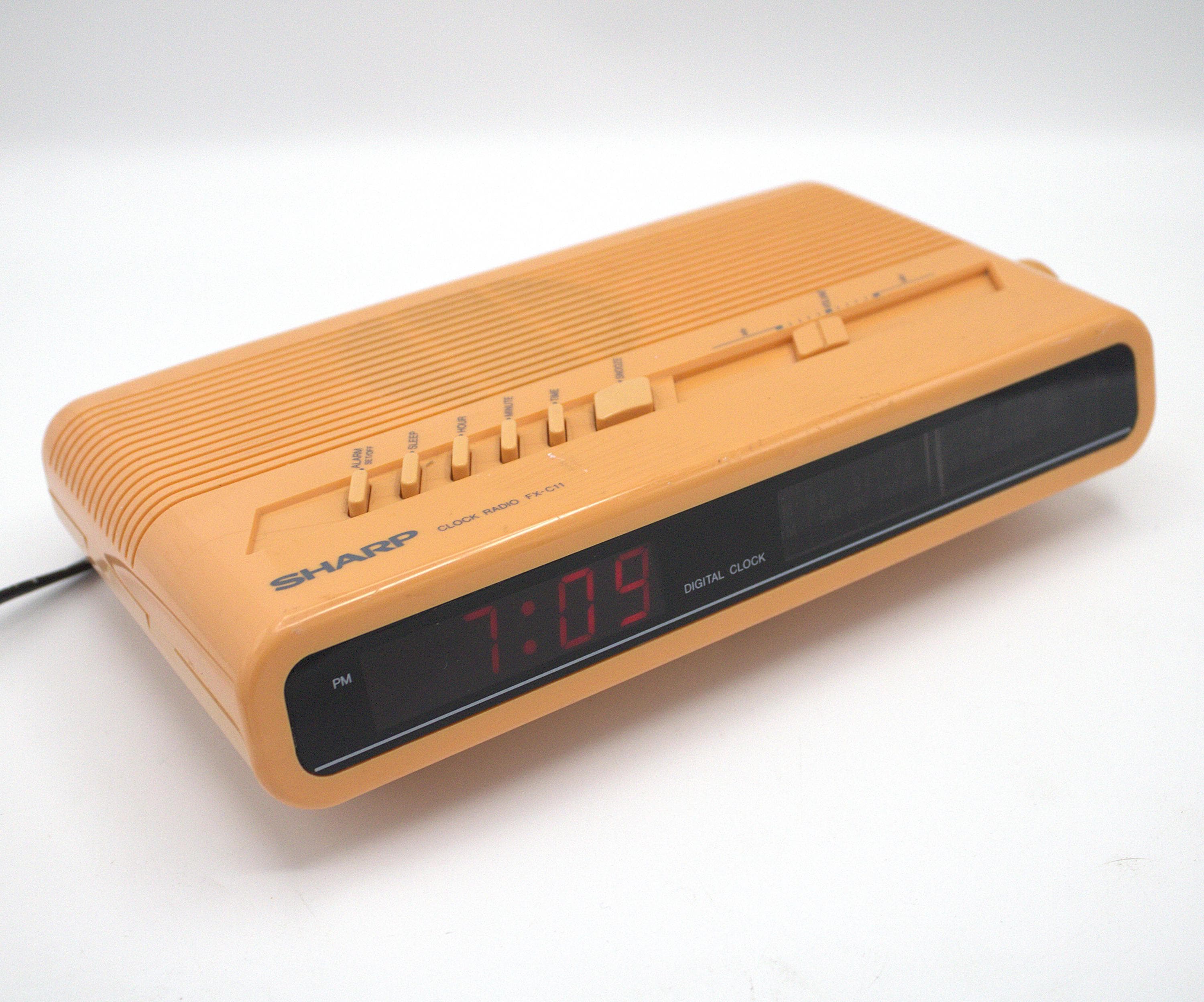 Vintage 1980s Sharp digital alarm clock radio AM/FM receiver red LED lighted dial salmon pink coral pastel 80s tech