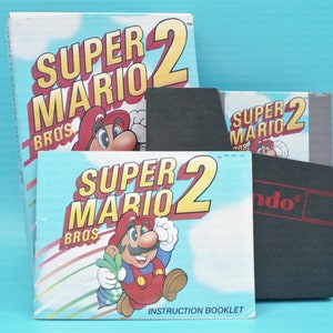 Vintage 1980s Nintendo Game Super Mario Brothers 2 NES cartridge complete in original box 1988 Mario Madness