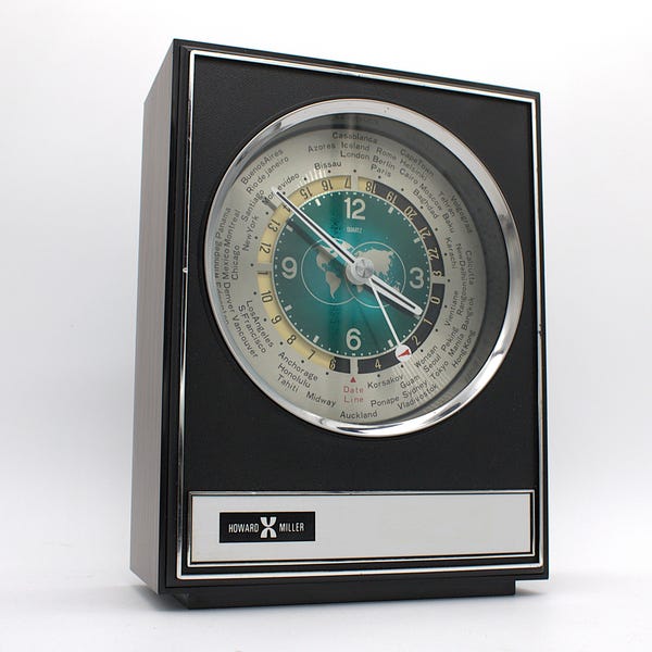 Vintage 1970s World Clock Howard Miller international time zone analog dial rocket second hand chrome woodgrain mod 60s-70s design