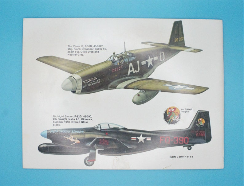 May include: Two illustrations of vintage military aircraft. The top image shows a green and brown P-51 Mustang fighter plane with the text "AJ--0" and "36 322". The bottom image shows a black F-82 Twin Mustang fighter plane with the text "FG-390" and "6390".